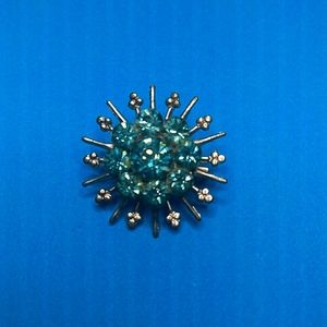 Starburst blue stone brooch